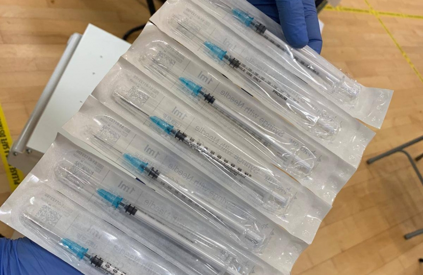 An Image of vaccines in their syringes, ready to be injected