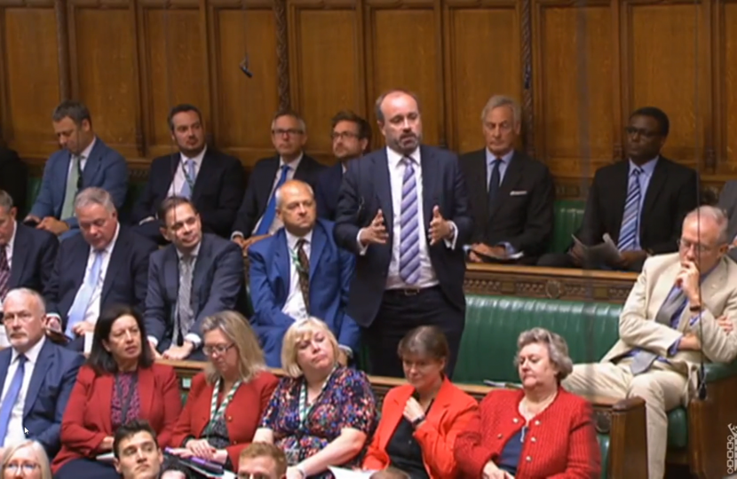 Aaron asking a question in Parliament