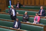 Aaron in Parliament asking the Environment Minister, Thérèse Coffey a question