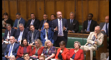 Aaron asking a question in Parliament